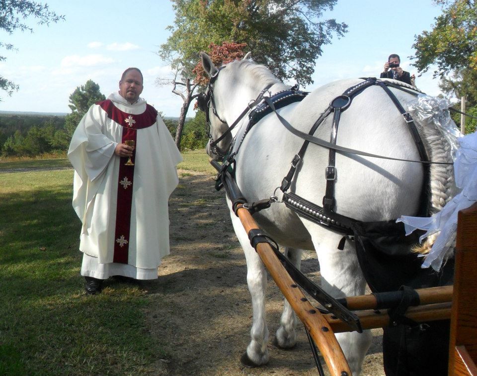 The priest blessing the horse!