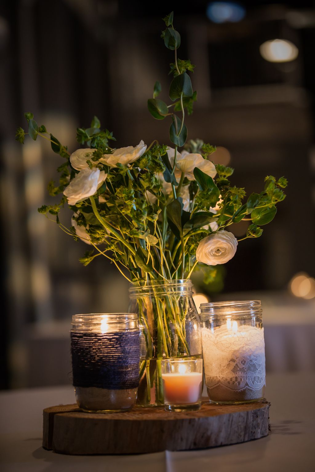 Centerpieces with candles on a wood slice