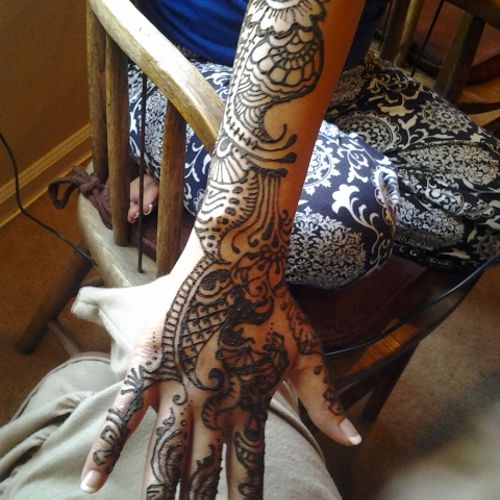 Bridal henna, one arm down, two feet, arm and hand