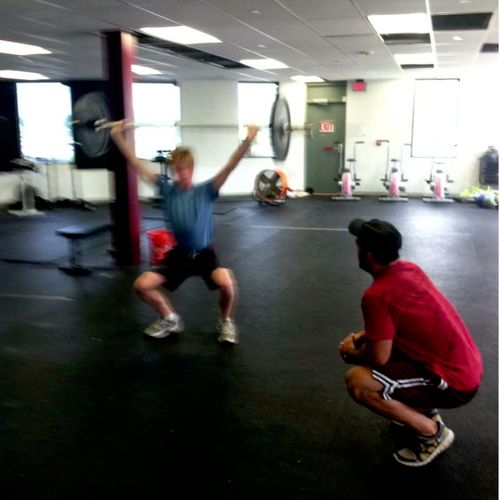 Coaching an athlete through an Overhead Squat at C