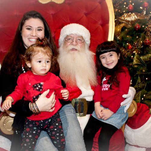 Family Giving Santa Bob their Christmas Wishes