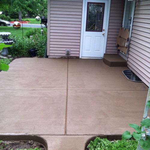 Fresh poured patio, colored broomed finish.