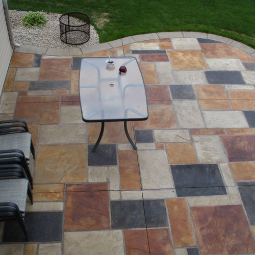 Random stone stamped patio with acid staining and 