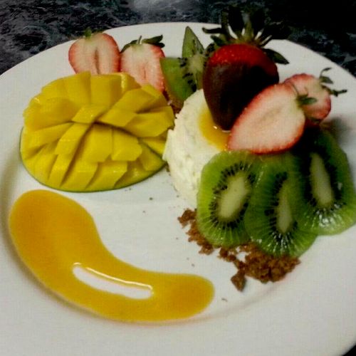 Tropical Cheesecaked Individual with Mango Coulis,