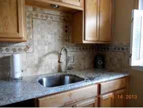 New kitchen with granite top and backsplash