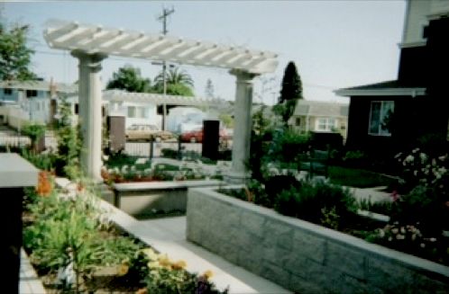 Arbor, with raised beds and plantings