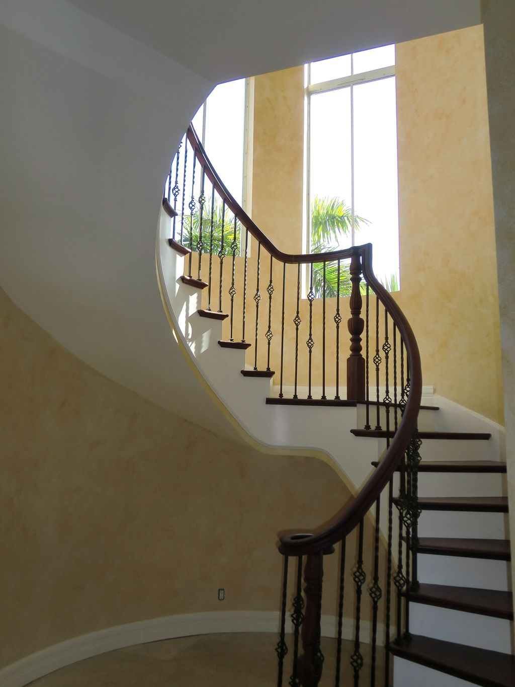 Paint and glaze finish in a spiral staircase.