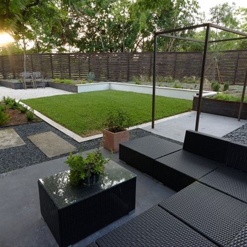 Modern backyard with seating and trellis