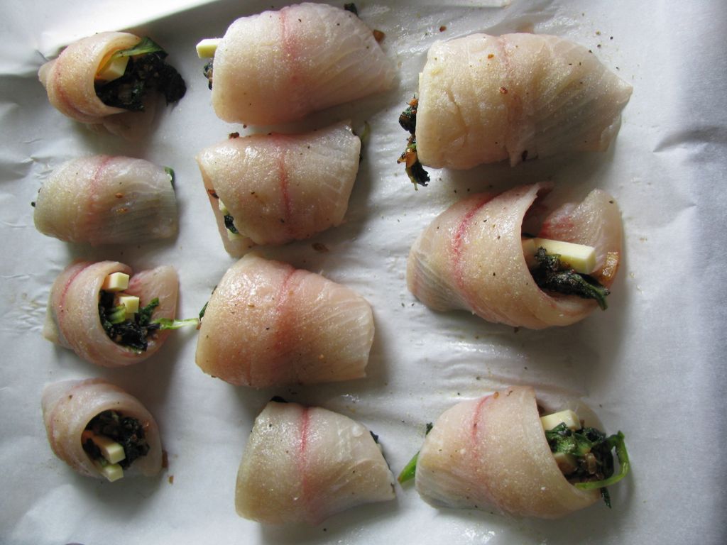 Tilapia stuffed with greens and cheese.