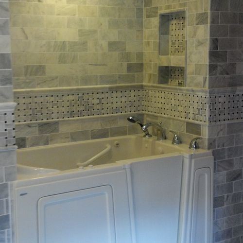 Walk-in Bathtub with custom marble tile