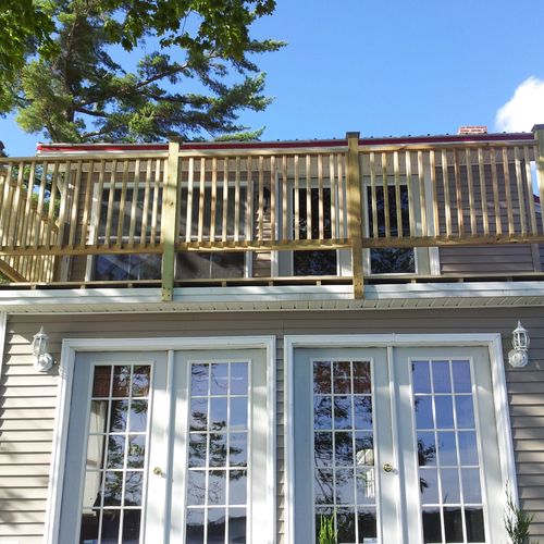 Constructed second story deck over the top of an E