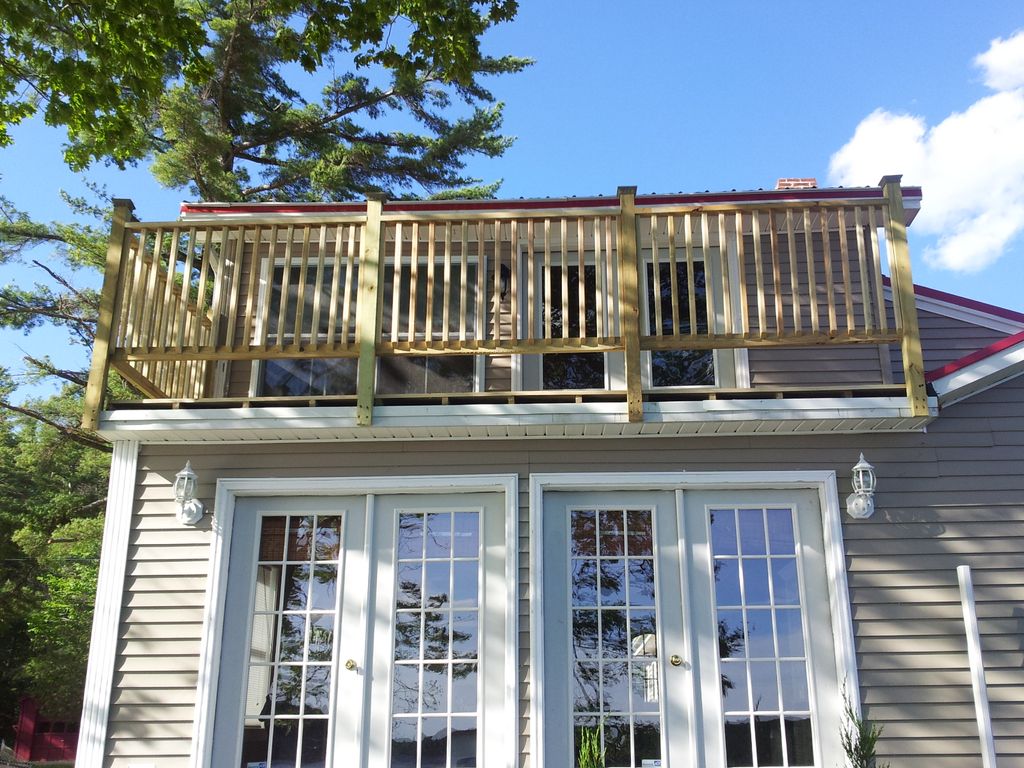 Constructed second story deck over the top of an E