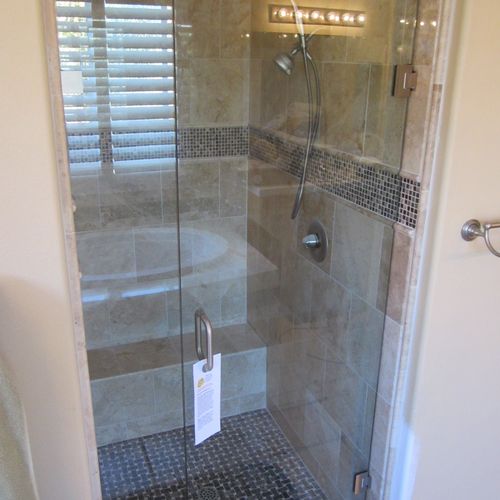 Remodeled Marble Stand up shower with frameless sh