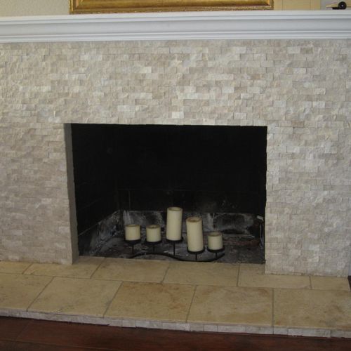 Refaced brick fireplace with cultured marble.