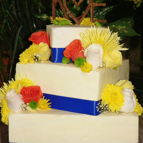 Three tiered wedding cake with Fresh Flowers!