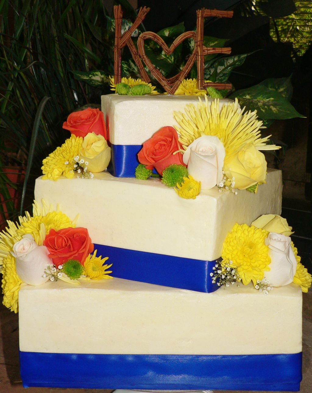 Three tiered wedding cake with Fresh Flowers!