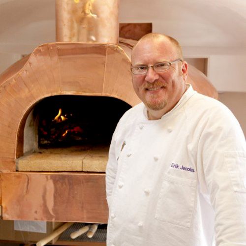 Chef Erik Jacobs standing in front of 
Forno D'Oro
