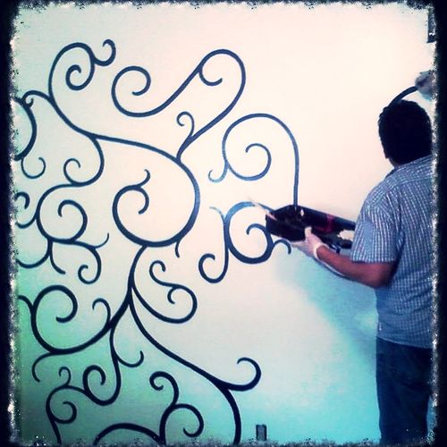 Free hand painted scroll mural. Interior residenti