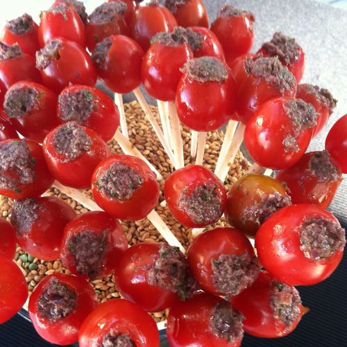 Olive stuffed cherry tomato pops
