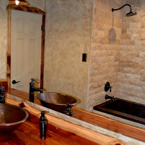 Rustic bathroom remodel with cedar countertops, co
