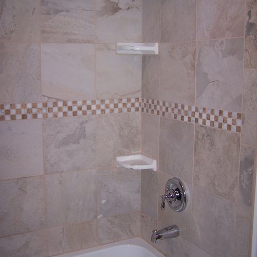 This is a custom shower surround installed over a 