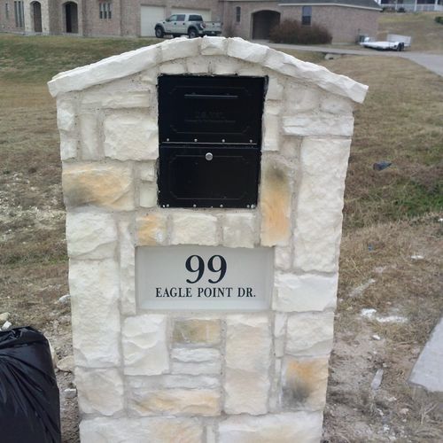One of my stone boxes.With locking mailbox. And ad