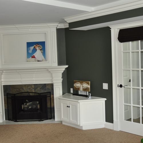 custom fireplace surround with TV box above it