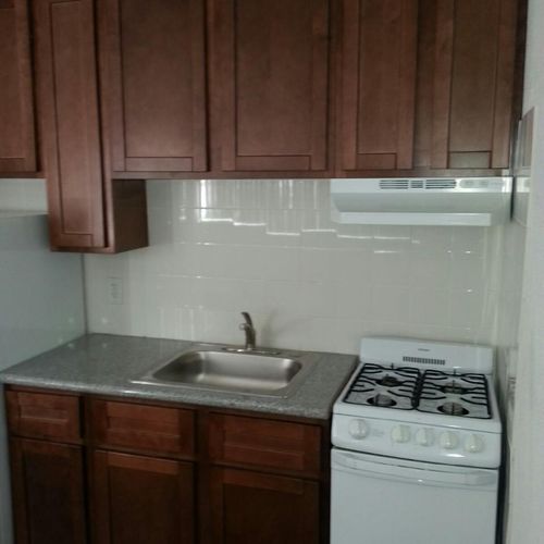 Small kitchen cabinet install with a 4 ft. granite