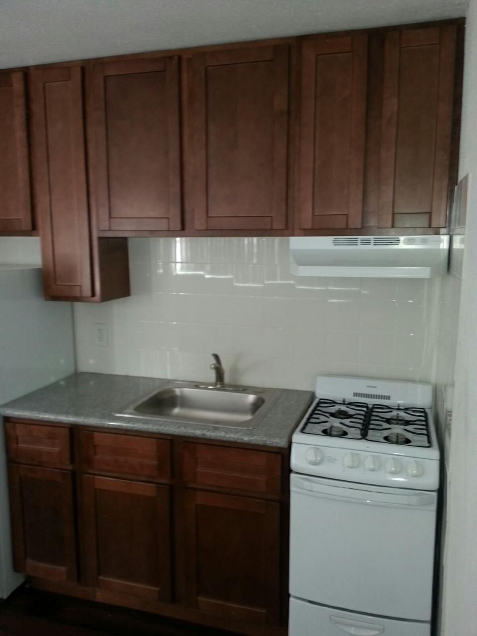 Small kitchen cabinet install with a 4 ft. granite