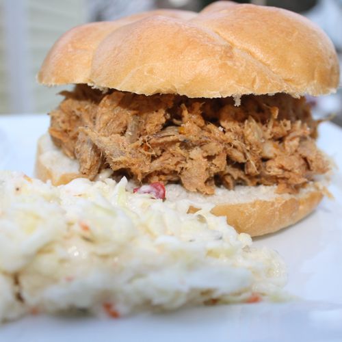 Our Pulled Pork BBQ is cooked low and slow and ser