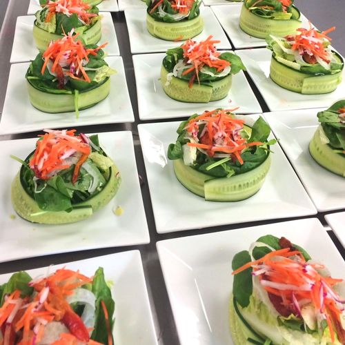 Cucumber wrapped Baby Greens with Carrots, Radish,