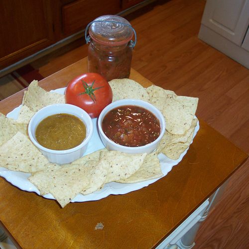 Homemade salsa, green and red