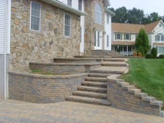 Stone wall decor on a home. Retaining walls with d