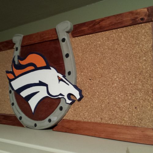 a corkboard for a Burrillville Broncos Cheerleader
