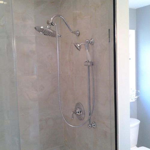 New tiled shower with bench and glass doors