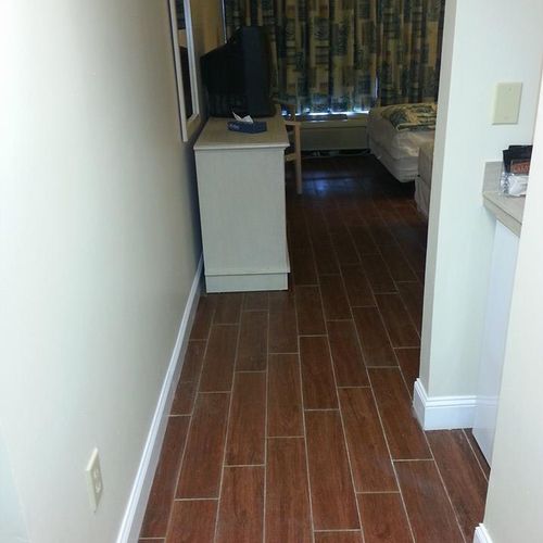 Ceramic tiled laid throughout condo.  Hardwood loo