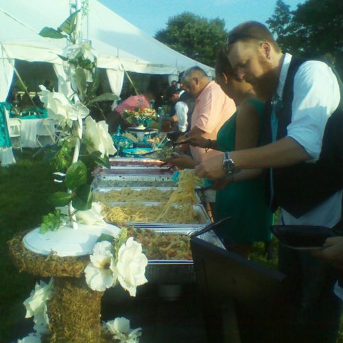 Outdoor wedding reception; buffet.