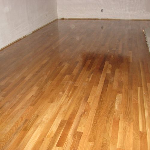 same floor after sanding and one coat of poly