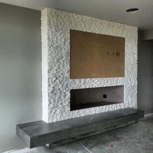 stone fireplace and custom made concrete bench
