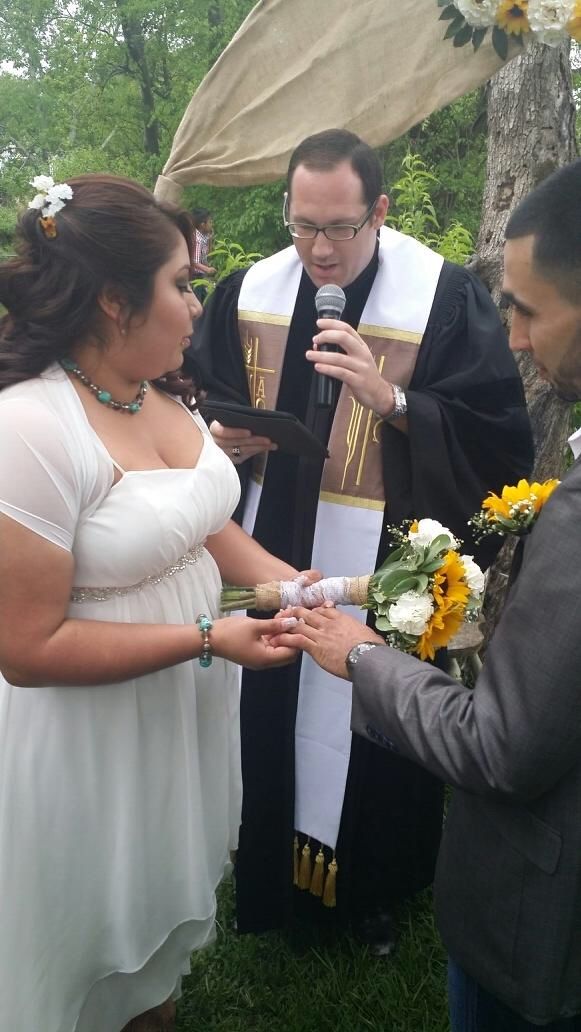 The bride and groom exchange rings!