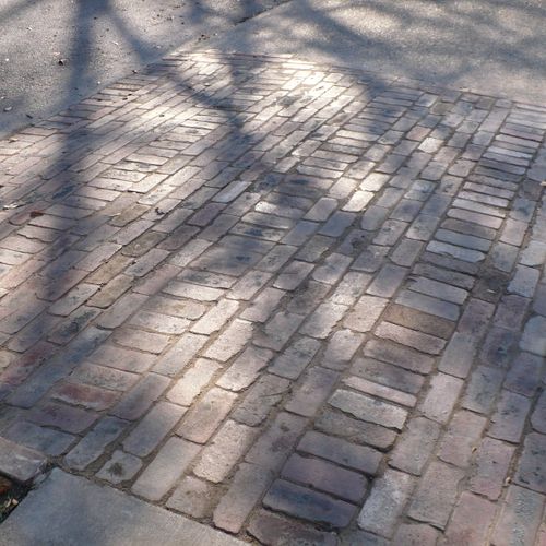 Driveway apron with Brick pavers from the streets 