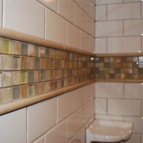 Classic subway tile design with a glass mosaic. A 