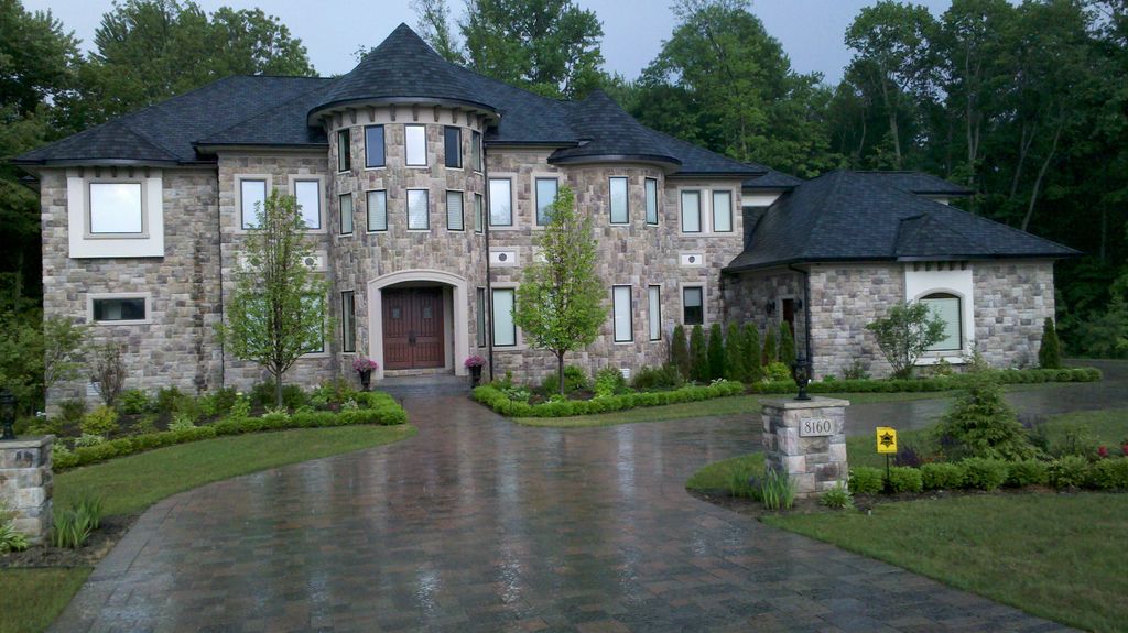 Grand front entry landscape with paving stone driv