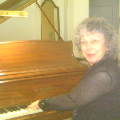 Gail plays Knabe Grand Piano in the music room at 
