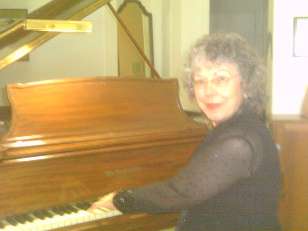 Gail plays Knabe Grand Piano in the music room at 