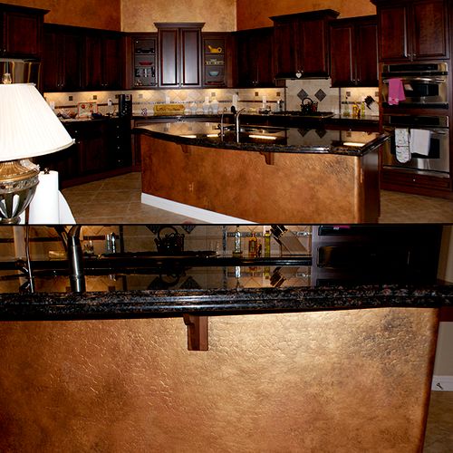 Faux finished aged copper walls and island wall