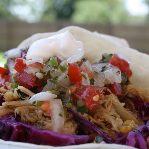 carnitas tacos, topped with mexican coleslaw, pico