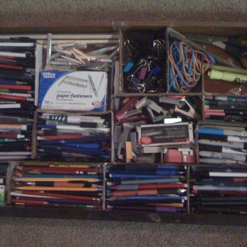 desk drawer organized with scraps of cardboard