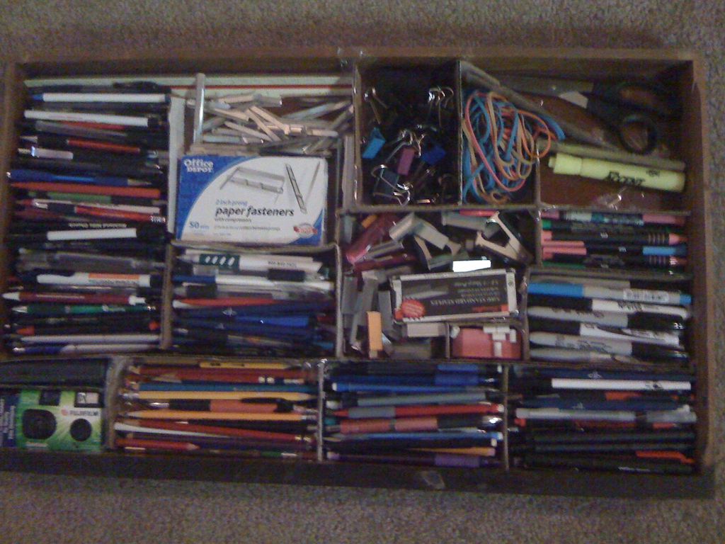 desk drawer organized with scraps of cardboard