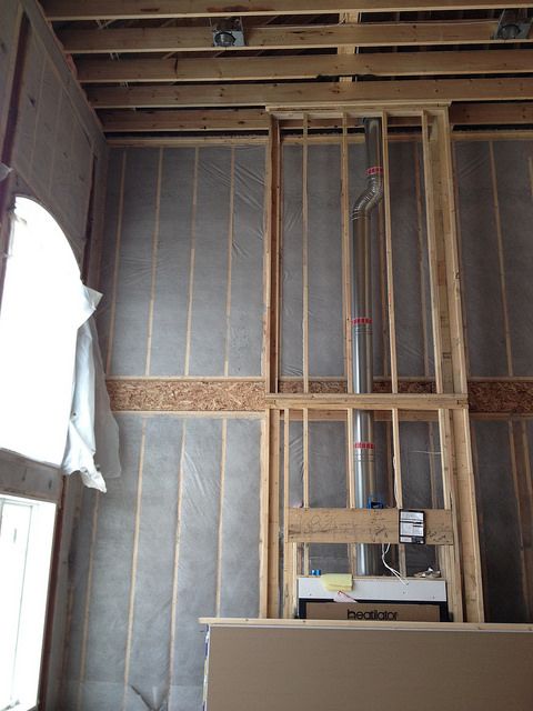 Cellulose insulation installed in the walls of a "